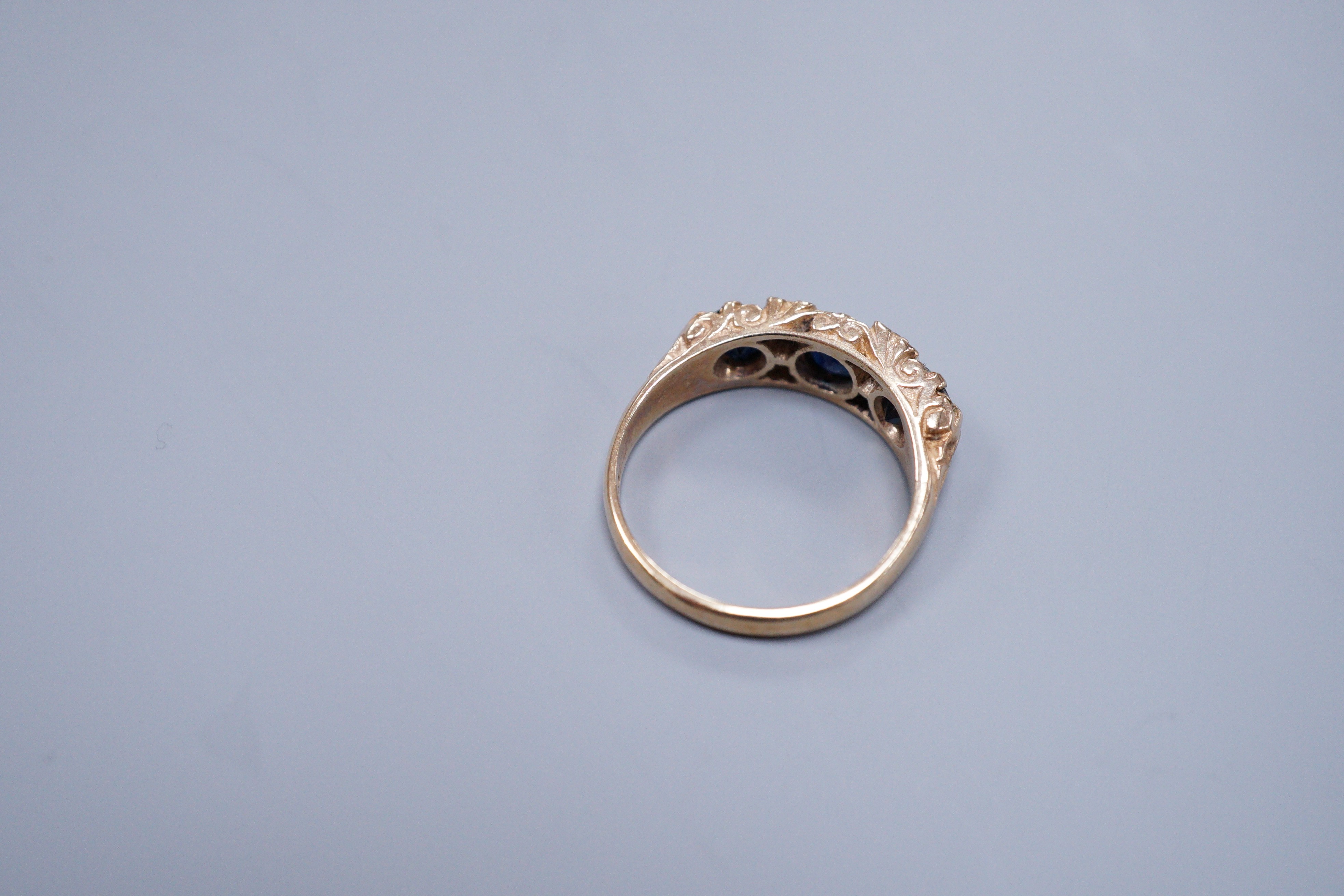 A 9ct gold sapphire and diamond half hoop ring, size O, gross 4 grams